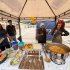 Stand de la Feria Gastronómica Afro con muestra de platos tradicionales y promoción del talento local.